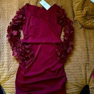 Beautiful dress with mesh flower sleeves brand new